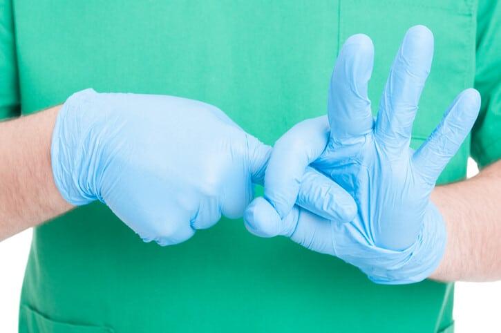 Doctor hands making obscene gesture