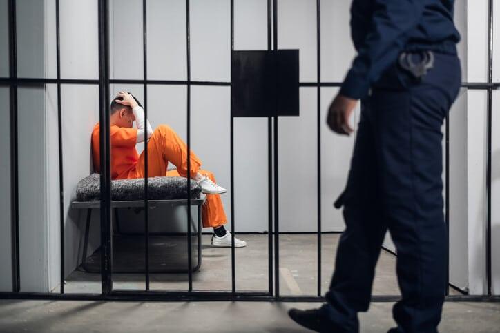 A prison guard makes a tour of the cells