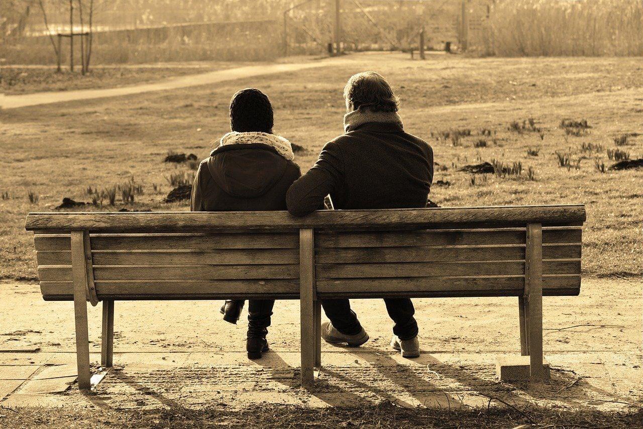 Couple Talking Over The Field