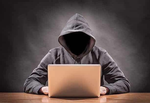 picture of a hacker on a computer online solicitation